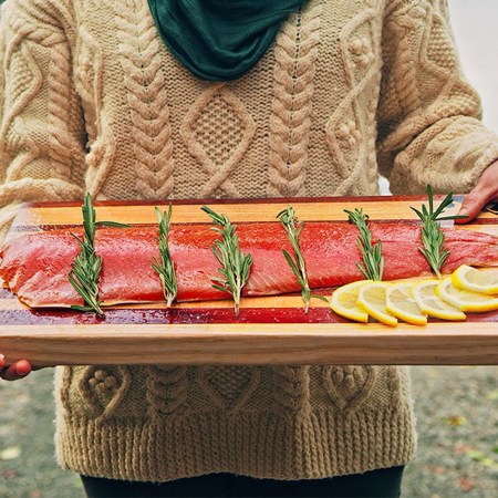 person holding prepared salmon lifestyle image