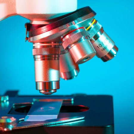 Microscope against a blue background