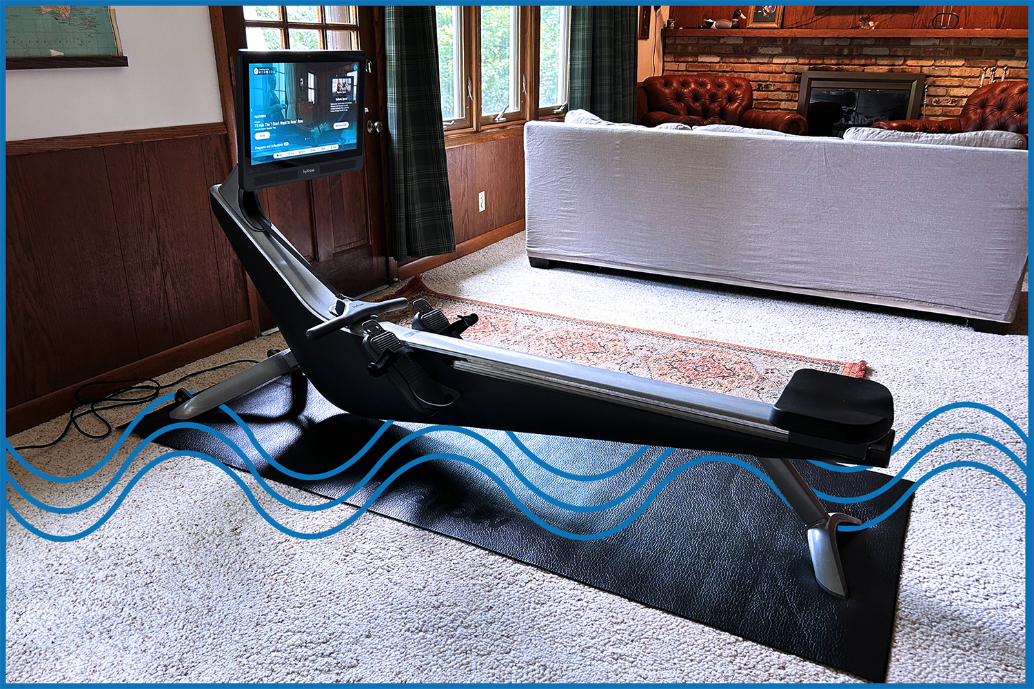 The Hydrow Pro, a rowing machine with a screen for classes and instruction, set up in my basement