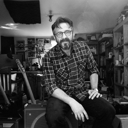Marc Maron photographed in 2015 in his garage where he recorded “WTF.” As his podcast comes to an end, we look back at his best episodes.