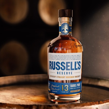 Russell's Reserve 13 bottle on a barrel