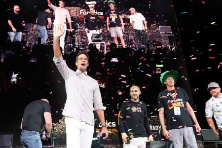 Tom Brady waves as confetti falls