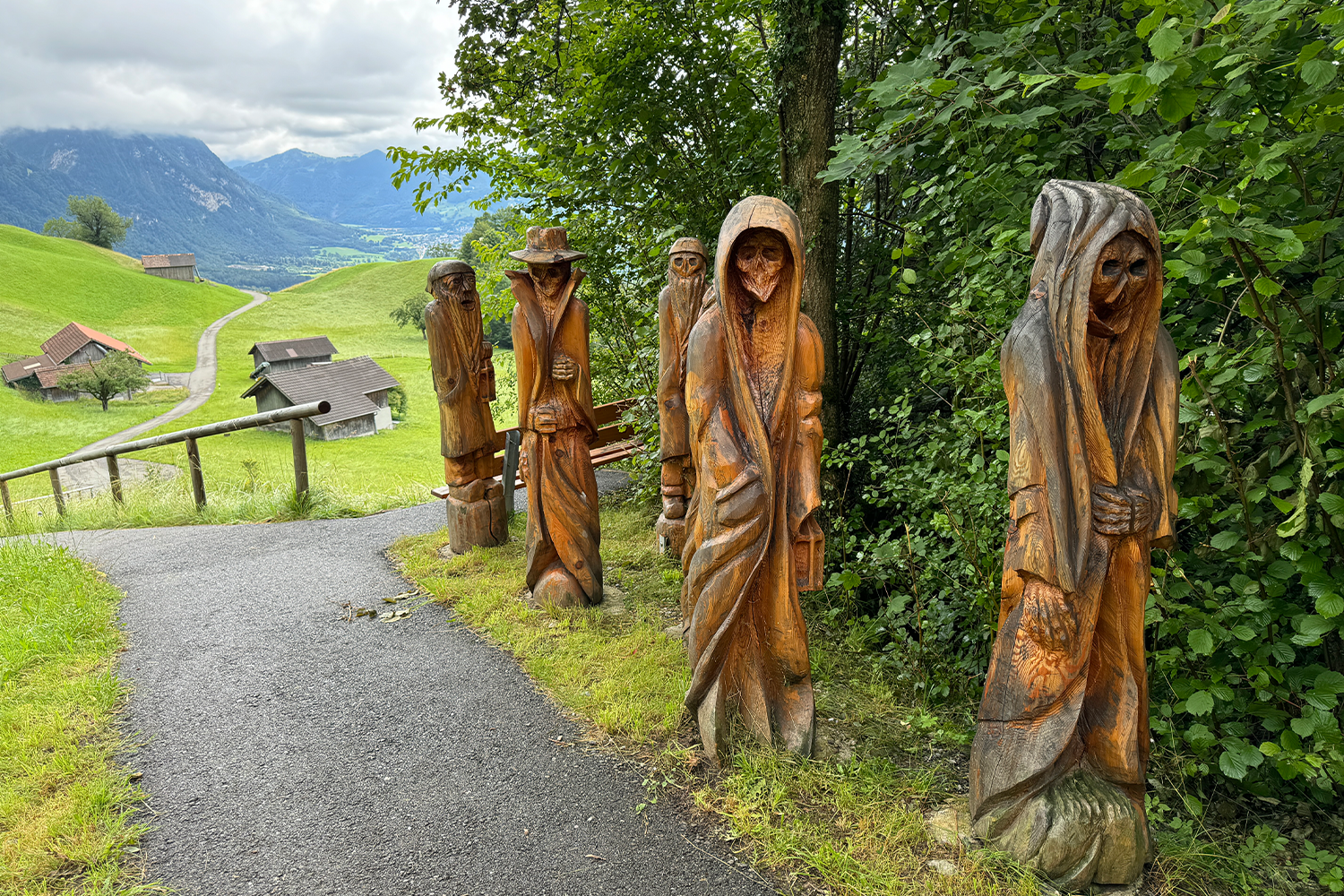 The next day’s hike led through thick larch and pine forests, passing creepy wooden statues of monsters and lost souls.