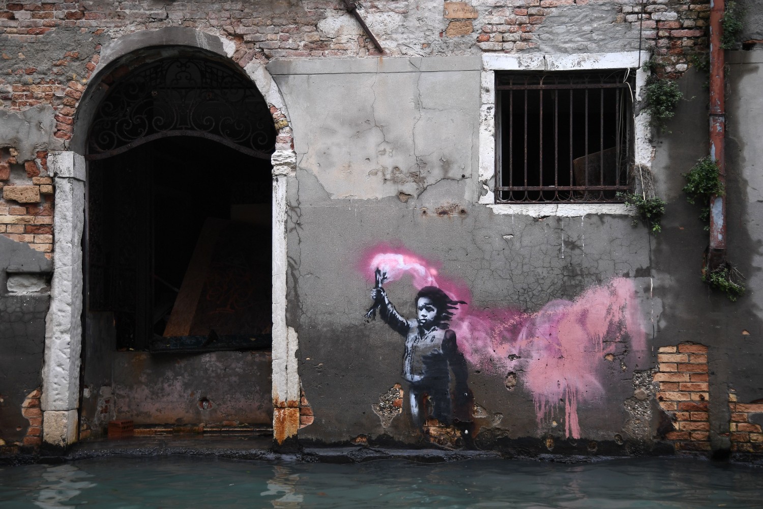 Banksy mural on a wall in Venice