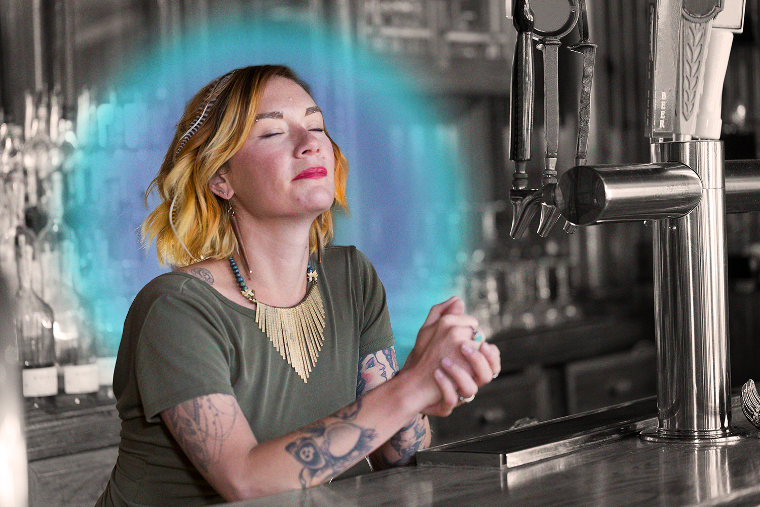 A bartender posing in a bar