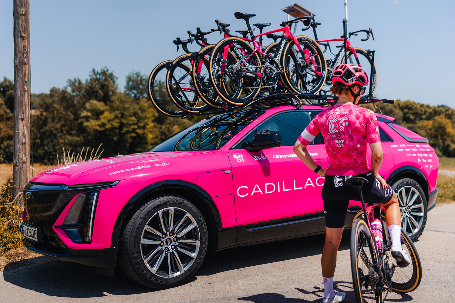 A pink Cadillac Lyriq used by the EF Pro Cycling team. It's even using the electric SUVs for its Tour de France effort.