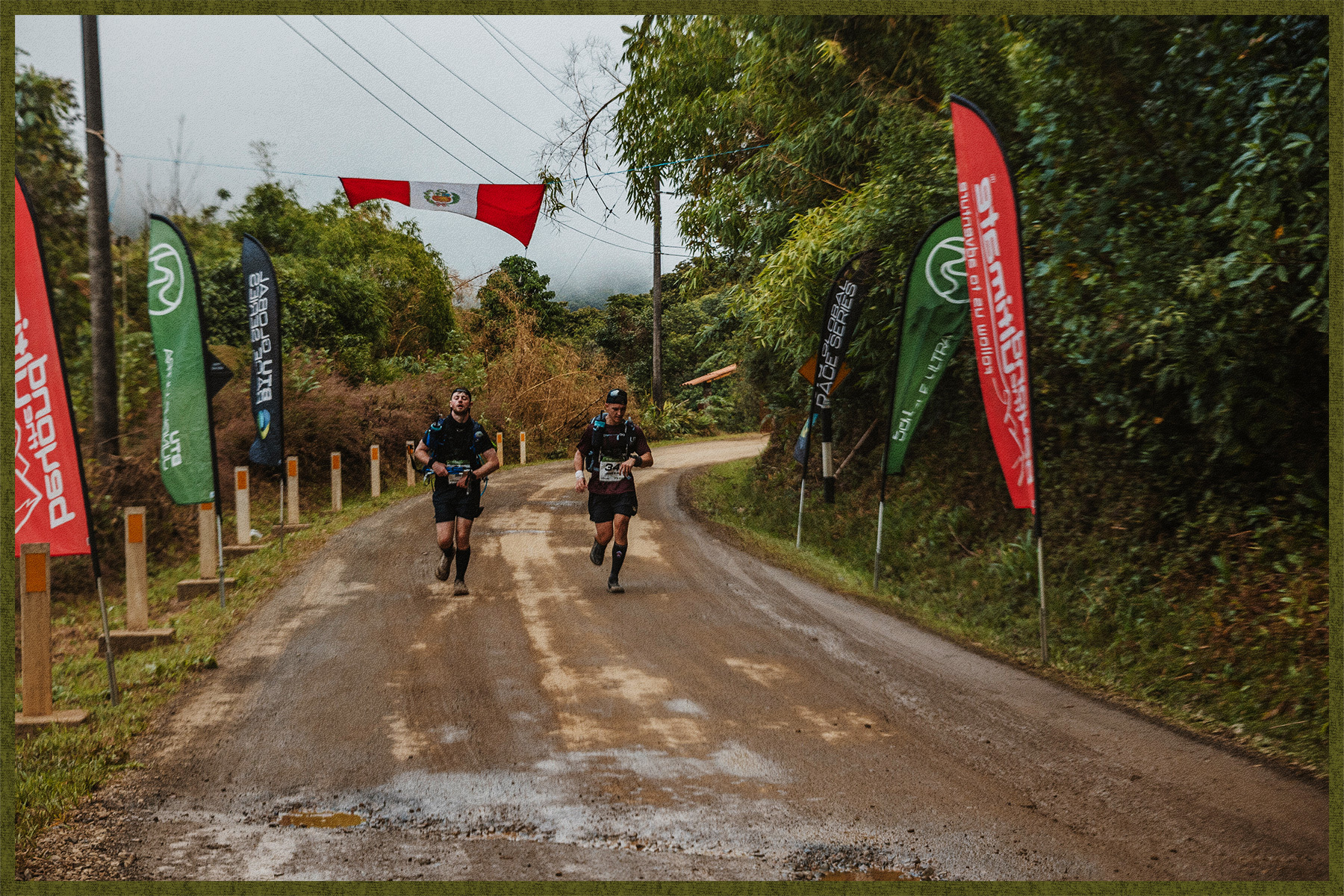 Two runners come around the final bend, as they complete the Jungle Ultra.