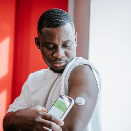 Man using an app to monitor his glucose levels