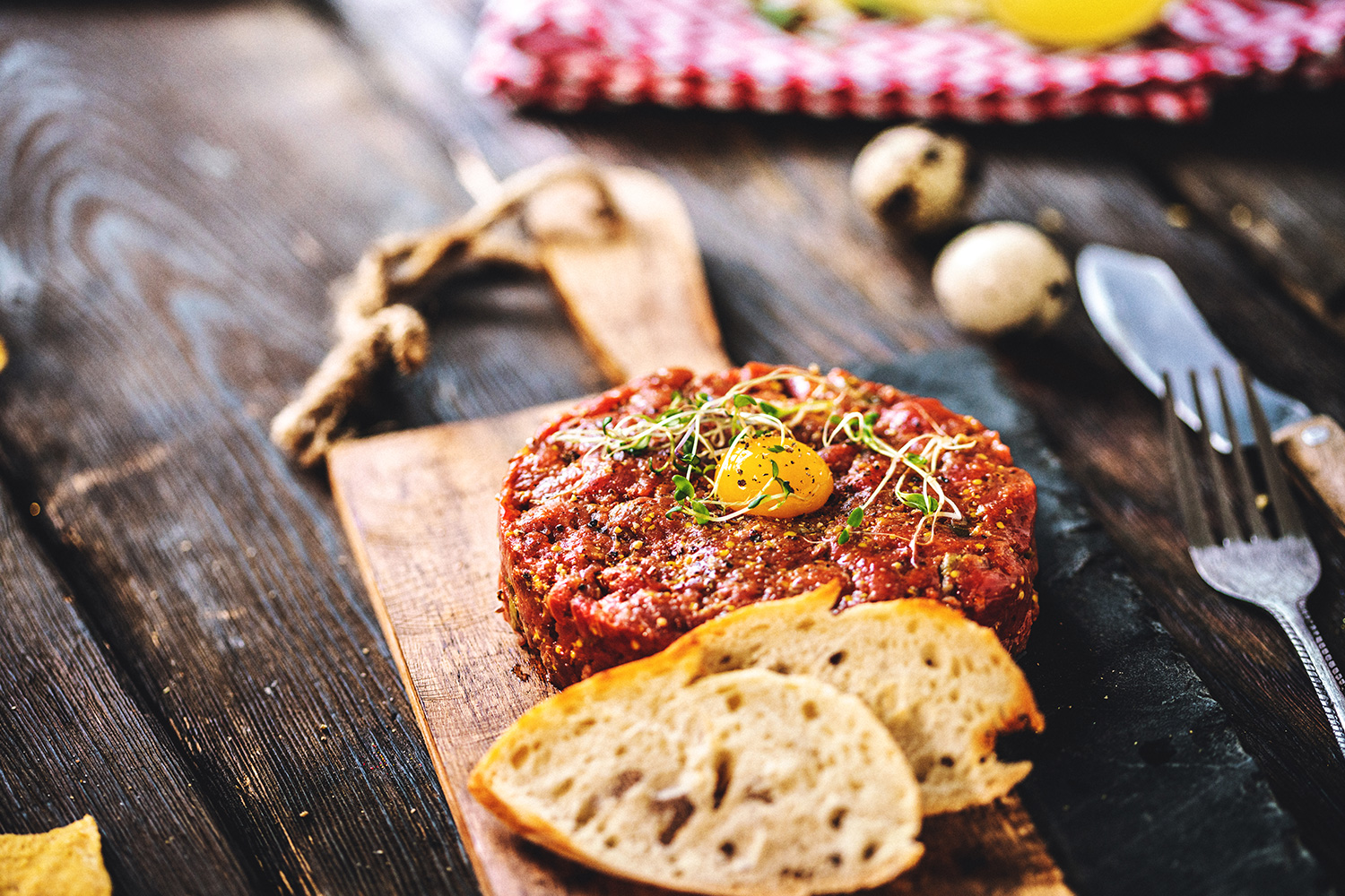 Delicious Beef tartare with quail egg and spices