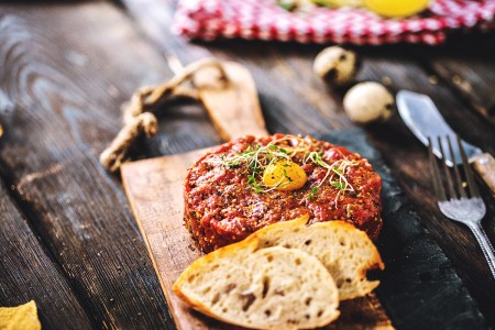 Delicious Beef tartare with quail egg and spices