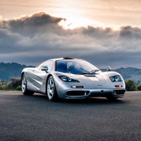 A 1997 McLaren F1 once owned by Larry Ellison sitting still with a setting sun in the background
