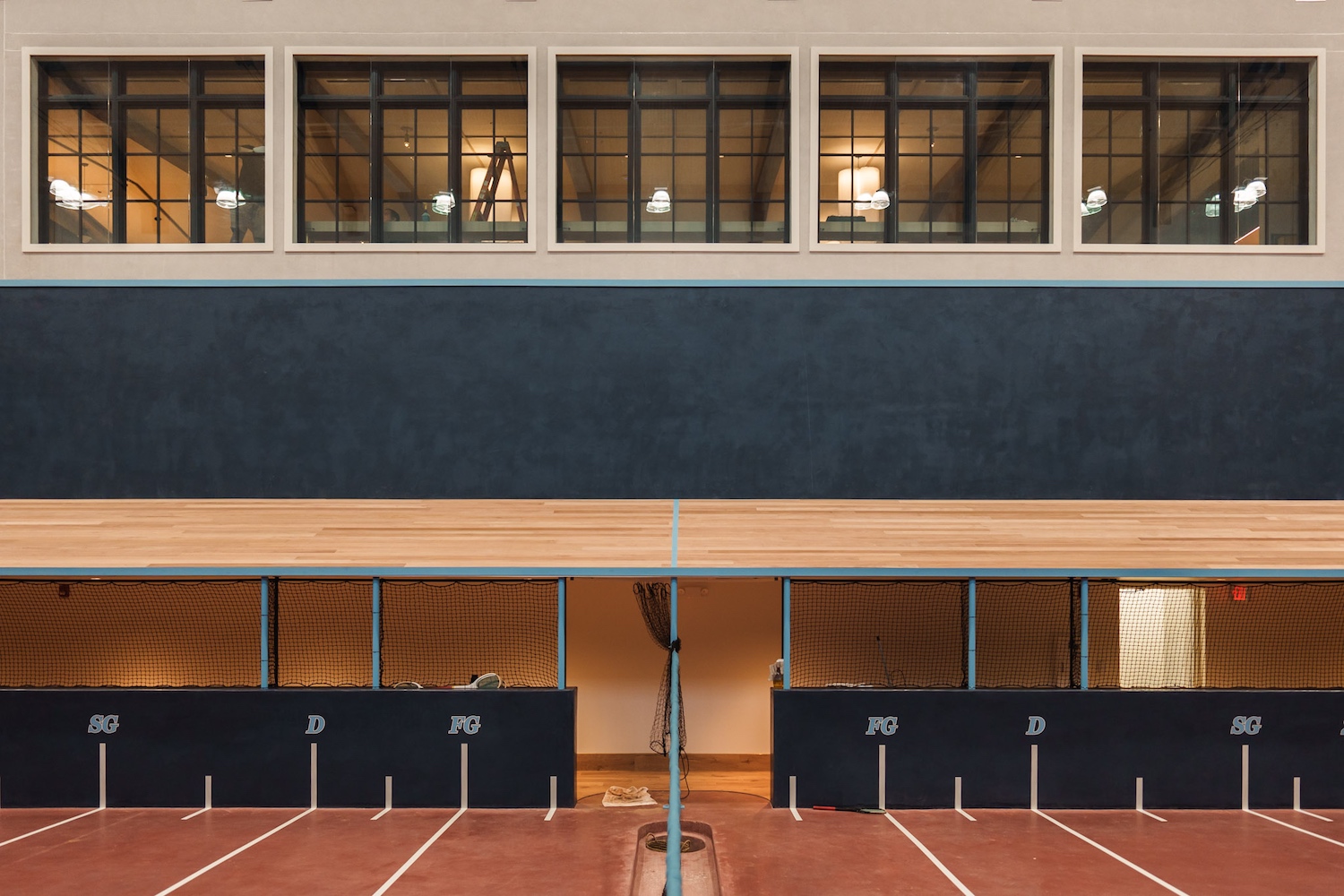 A view of the demarcated sideline to a real tennis court.