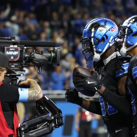 ESPN camera operator filming NFL players