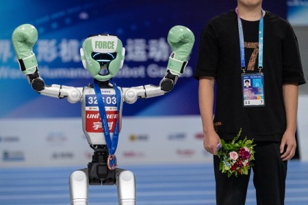 A kickboxing robot flexing