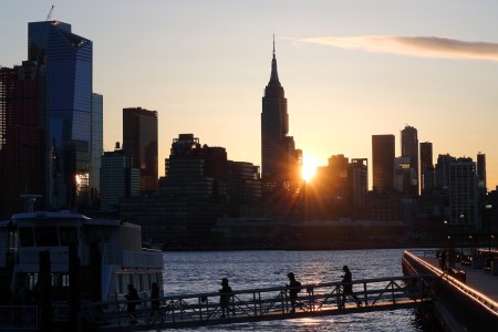 The sun rising over New York City. We discuss seven habits that can lead to a healthier workday.