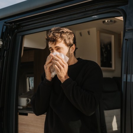 Sneezing man existing transit