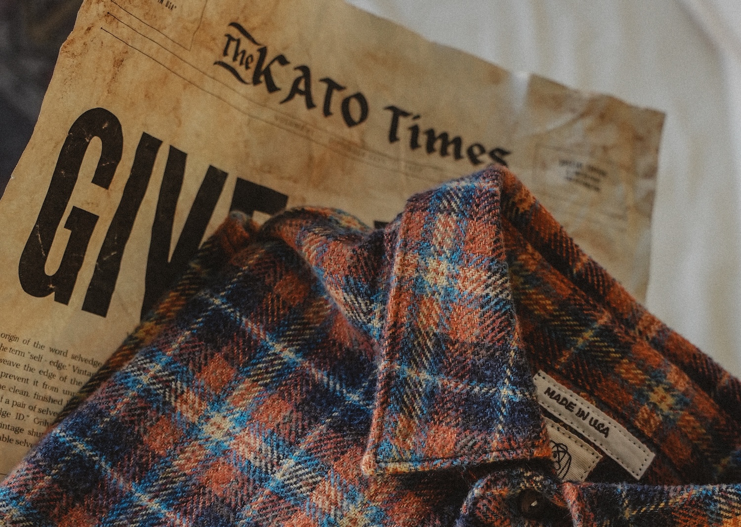 Flannel on top of a newspaper