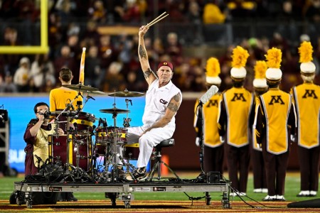 Chad Smith drumming at a football game
