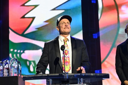 Woody Harrelson speaking at a podium