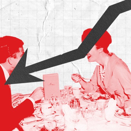 A man and a woman sitting down to dinner in a photo illustration with a downward trending arrow