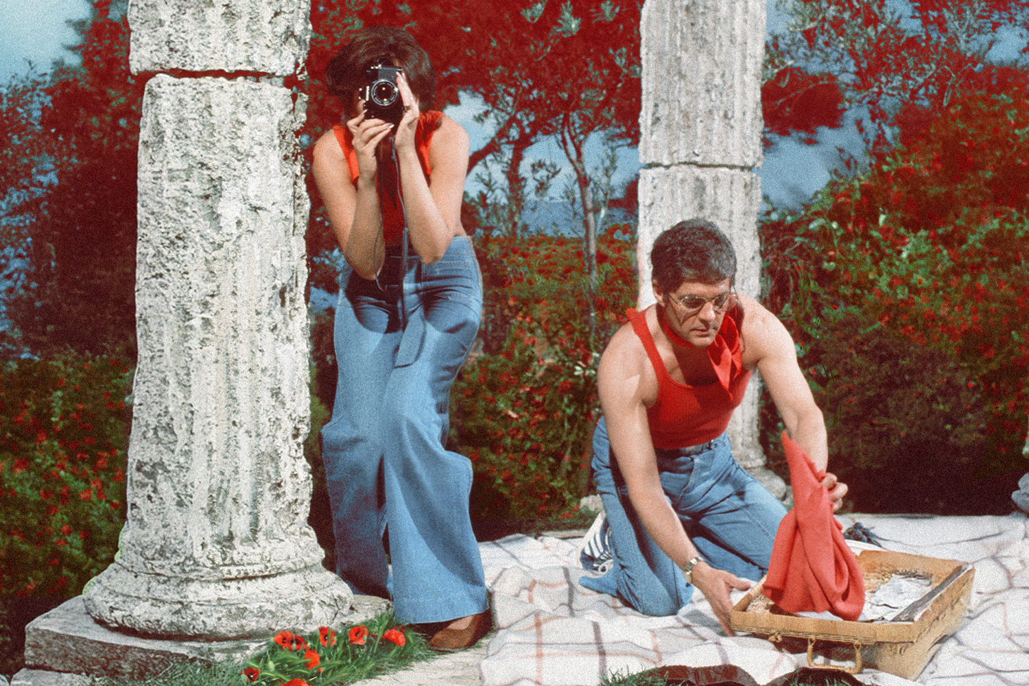 A man and woman taking photos together
