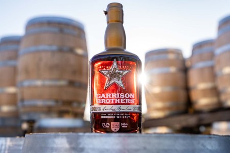 Garrison Brothers 2025 Cowboy near some barrels