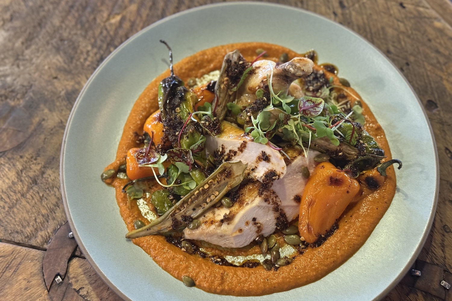 An airline chicken breast with romesco sauce and mini bell peppers, from The Ranch at Rock Creek. I got the recipe.