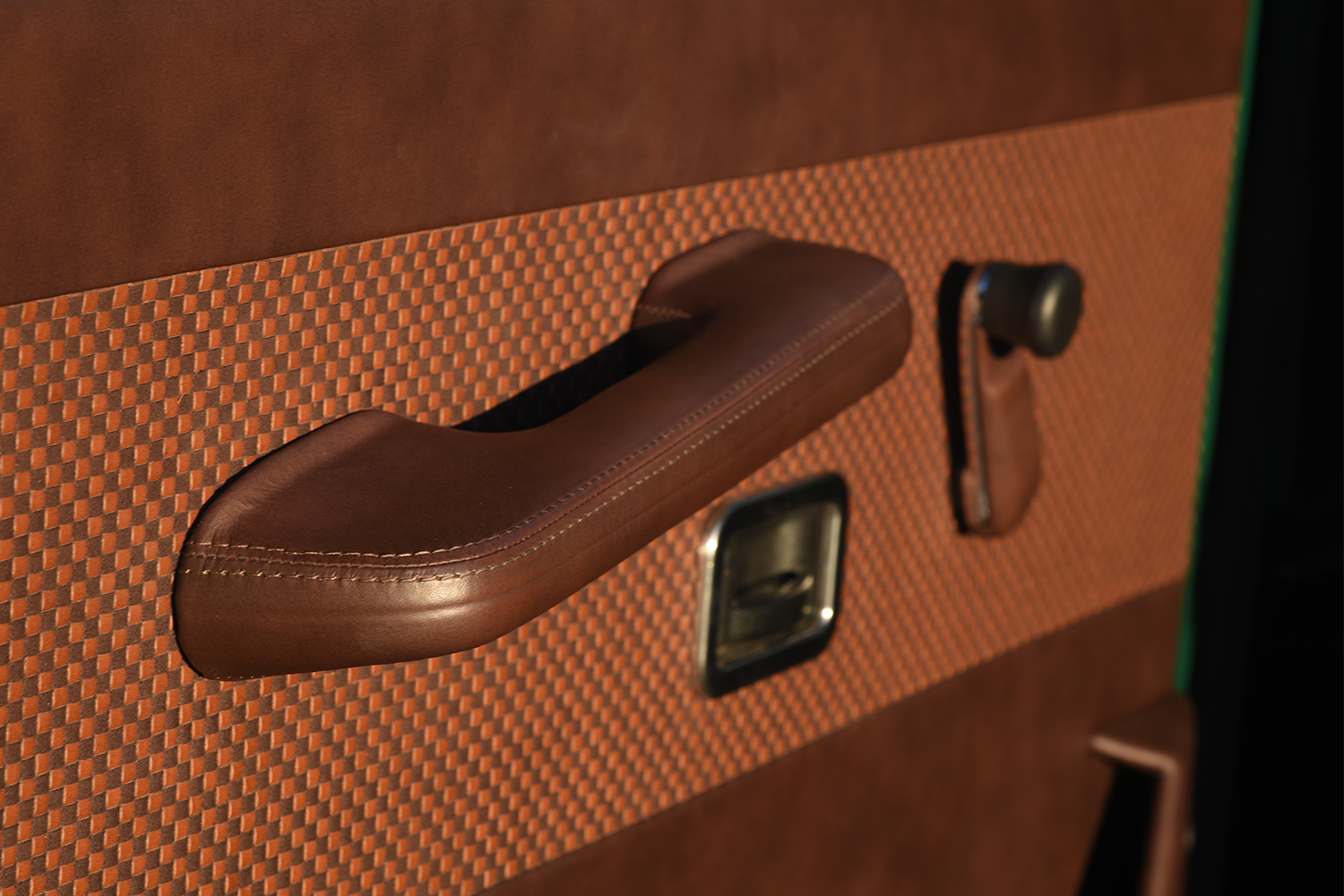 The leather wrapped handles in a G-Class restomod from Arcade Cars