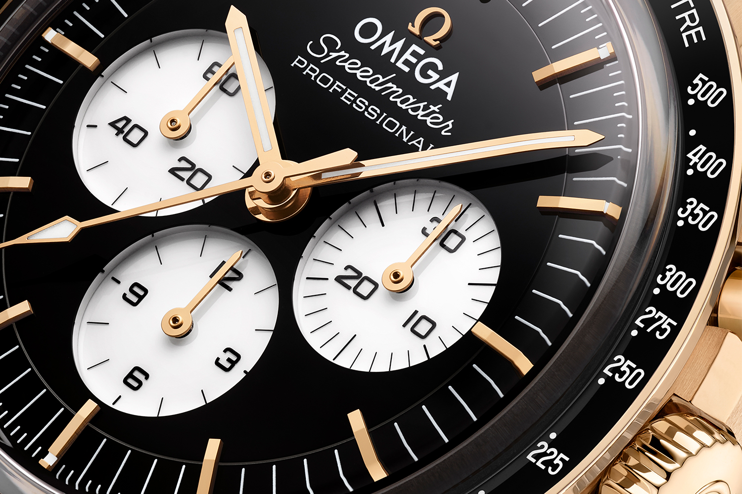 One of the new Omega Speedmaster Moonwatch Professional watches with a black and white reverse panda dial, this model is gold while the other is stainless steel