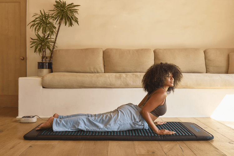 a woman on a yoga mat doing cobra yoga pose