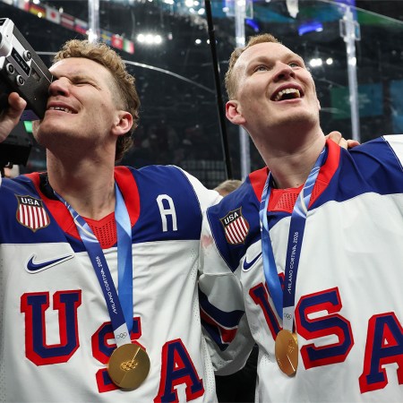 Gold medalist Matthew Tkachuk #19 and Brady Tkachuk #7 of Team United States celebrate after the medal ceremony for Men's Ice Hockey following the Men's Gold Medal match between Canada and the United States on day 16 of the Milano Cortina 2026 Winter Olympic games at Milano Santagiulia Ice Hockey Arena on February 22, 2026 in Milan, Italy.