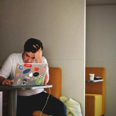 Stressed man on laptop