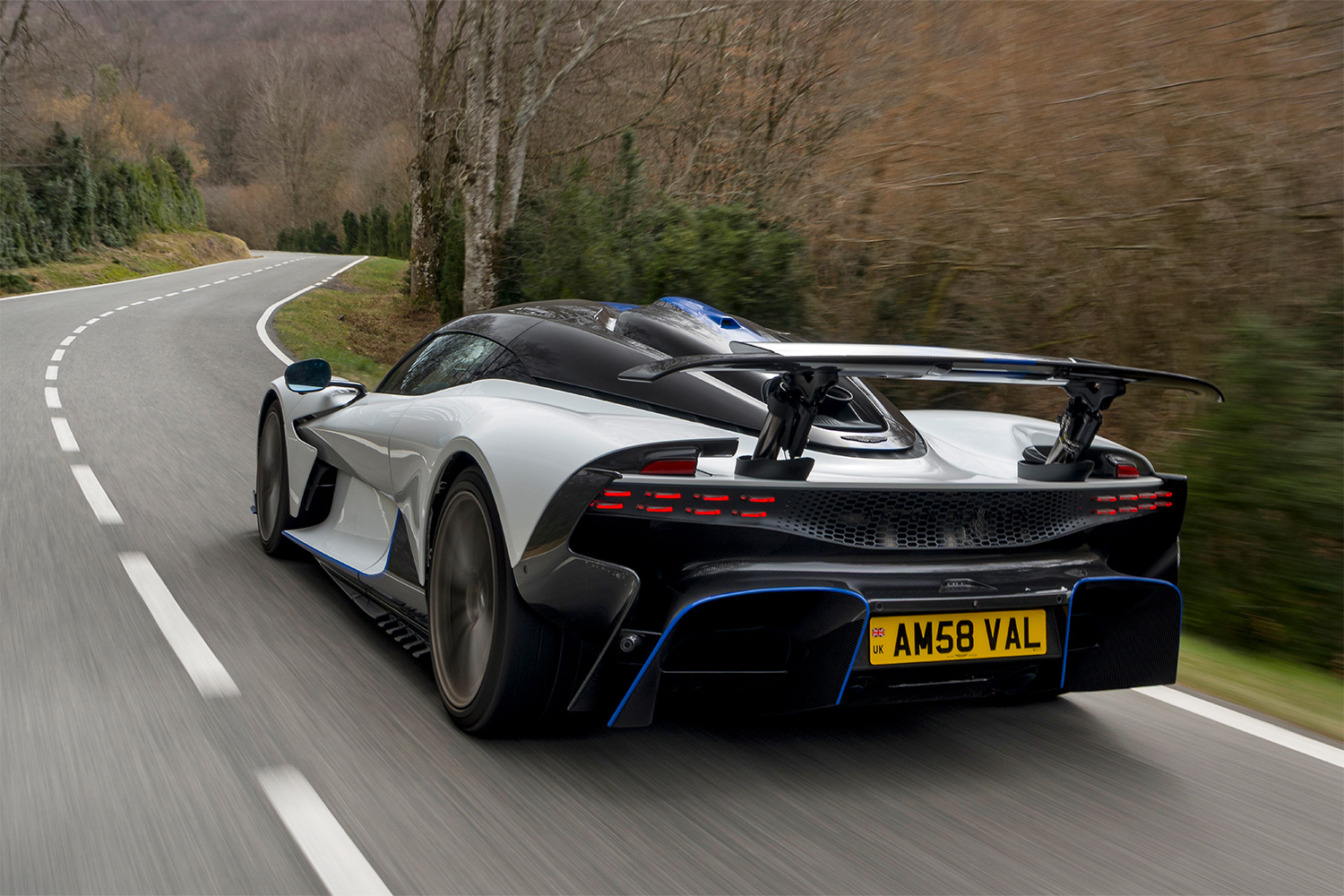 The rear end of the Aston Martin Valhalla supercar as it drives down the road