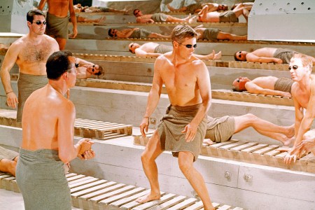 A bunch of men in a sauna at a bachelor party weekend