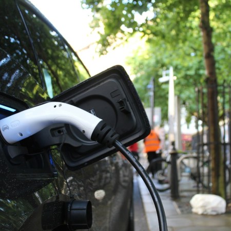 Electric vehicle being charged