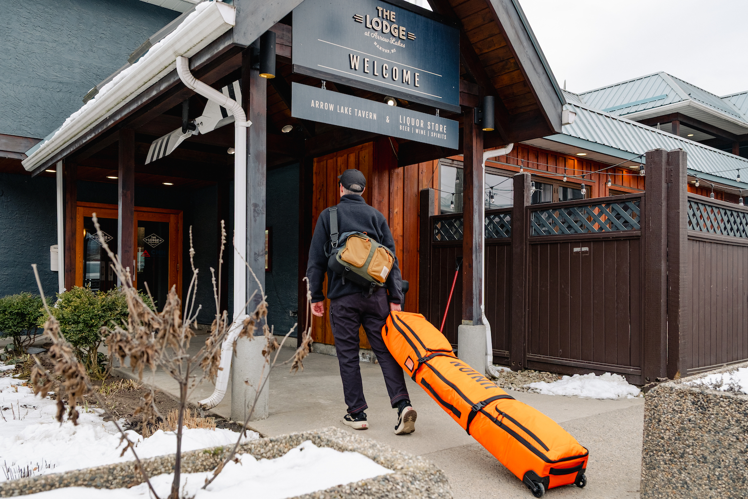 A man walking into a lodge.