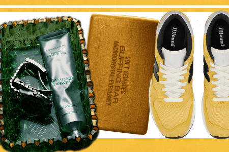 A glass tray with handcream on it, a golden bar of soap and yellow sneakers on a white and yellow background.