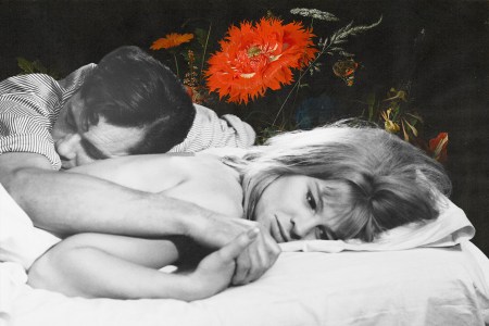 A man and woman lying in bed.