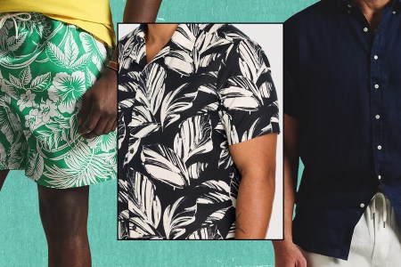 A man wearing green swim trunks, another in a black and white print shirt, and one in a blue linen shirt