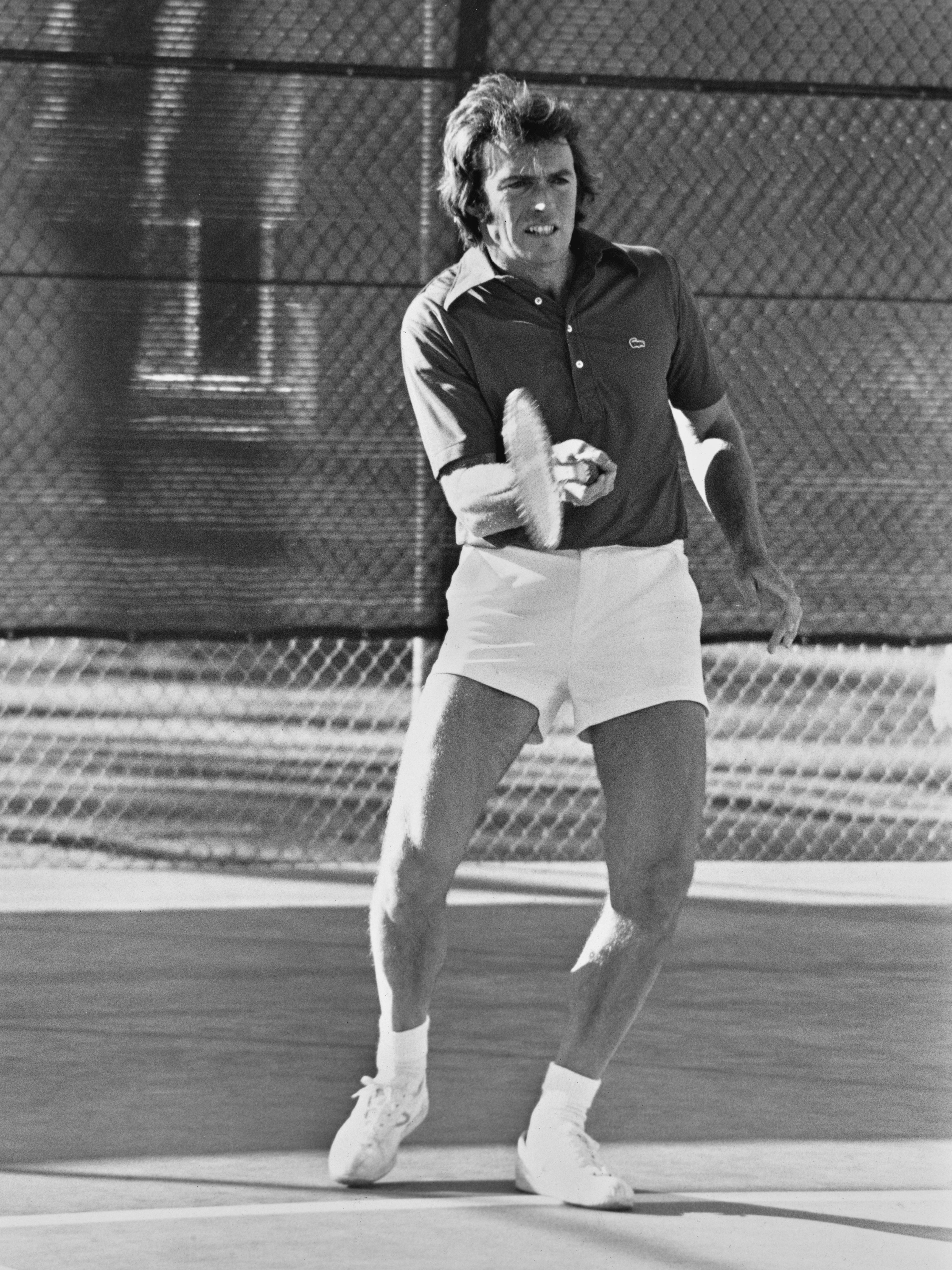 Clint Eastwood playing tennis