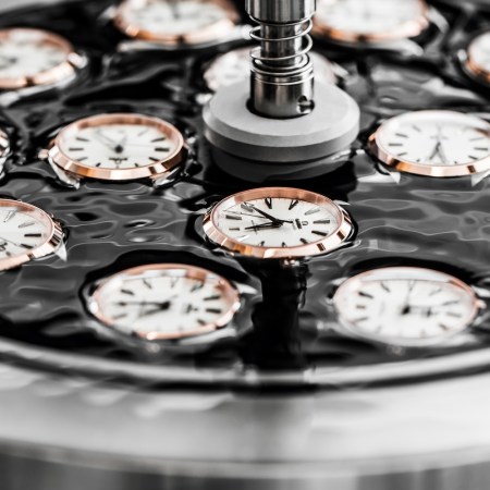 Watch cases sitting in a black disc
