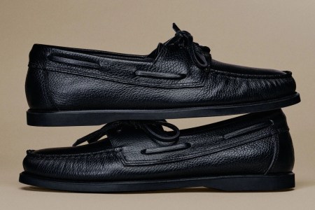 a pair of black leather boat shoes