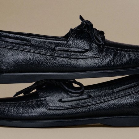 a pair of black leather boat shoes