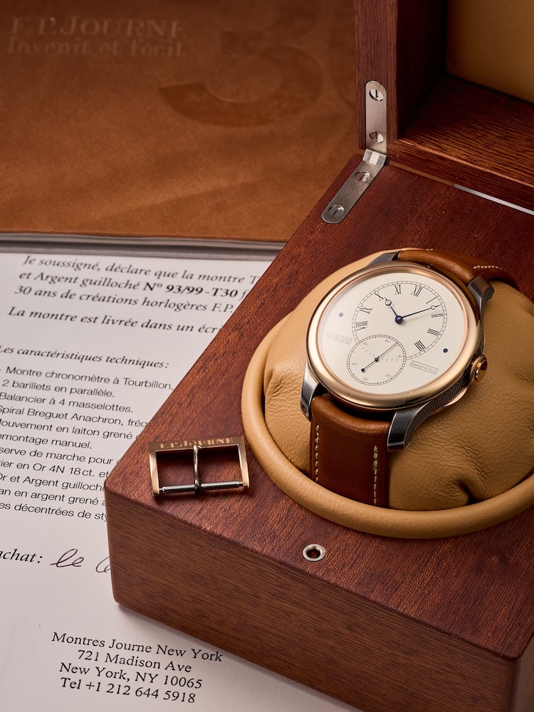 F.P. Journe watch in a wooden box with a brown leather strap