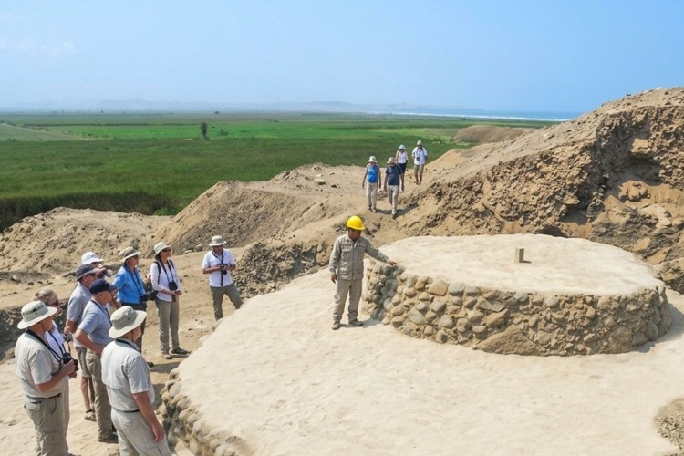 People gathered around an ancient observatory