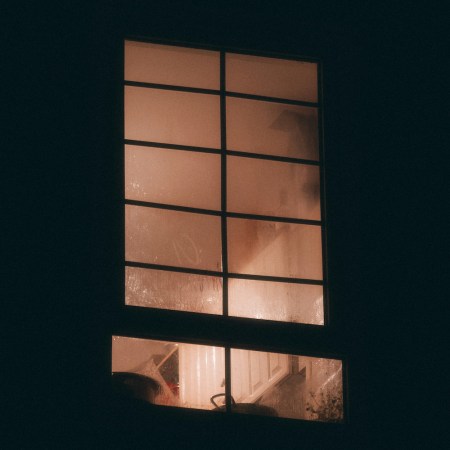 A bedroom window at night.