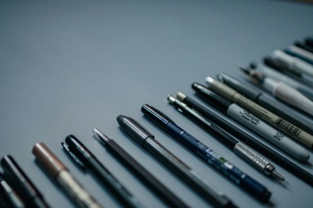 Pens against a gray background