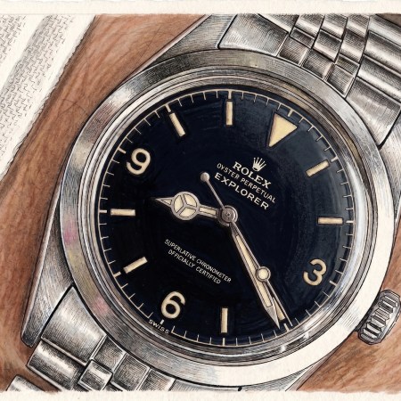 a man wearing a gilt dial watch