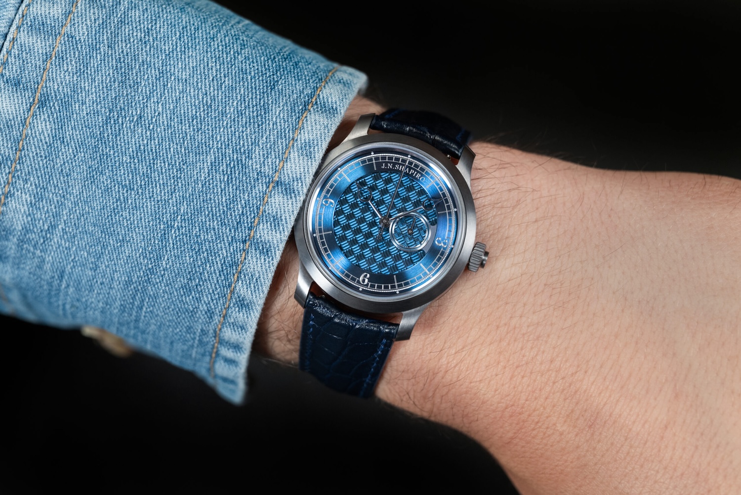 a model wearing a blue face J.N. Shapiro watch