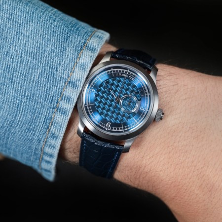 a model wearing a blue face J.N. Shapiro watch